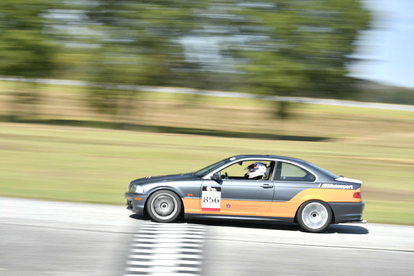 People hanging out of AUA E46 at homecoming 2025